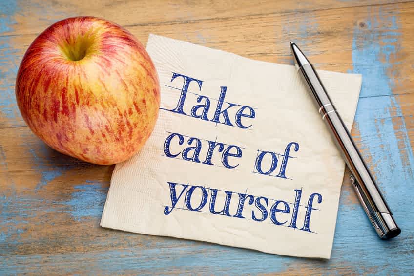 57103030 - take care of yourself advice or reminder - handwriting on a napkin with a fresh apple